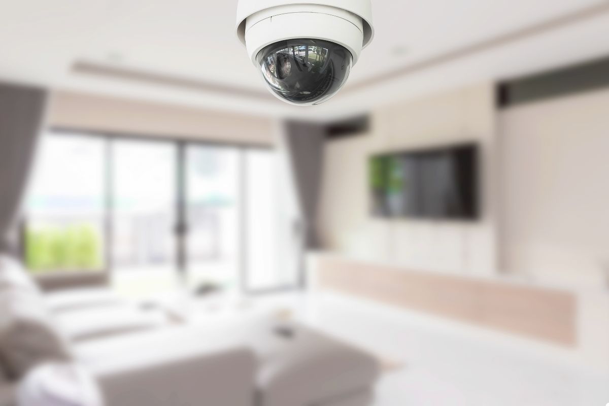 A home security camera securely mounted on a wall, ensuring safety and surveillance for the property.